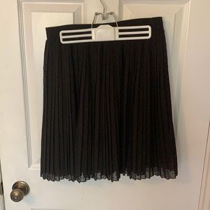 Pleated black polka dotted skirt